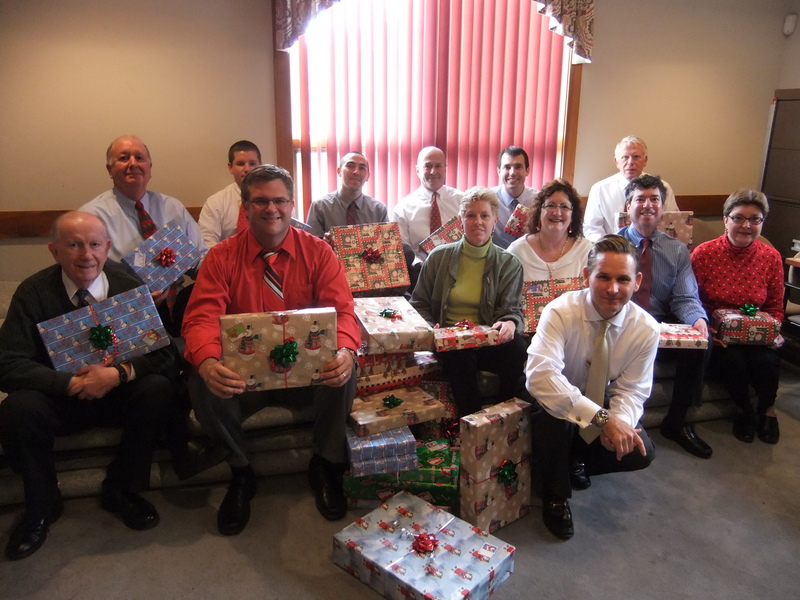 Agents at Merrill Lynch in Rehoboth Beach pitched in to adopt a family for the third consecutive year. Pictured in the back row are (l-r) Bruce Chilcoat, Michael Shook, Kyle Ricker, Bob Sturgis, Ryan Williamson and Ken Drerup. Pictured in the front row are Ed McGehrin, Josh Currence, Janet Redman, Paula Sellers, Ron Miller and Rita Mahaffey. Jamie Gamuciello is in the foreground. BY KARA NUZBACK